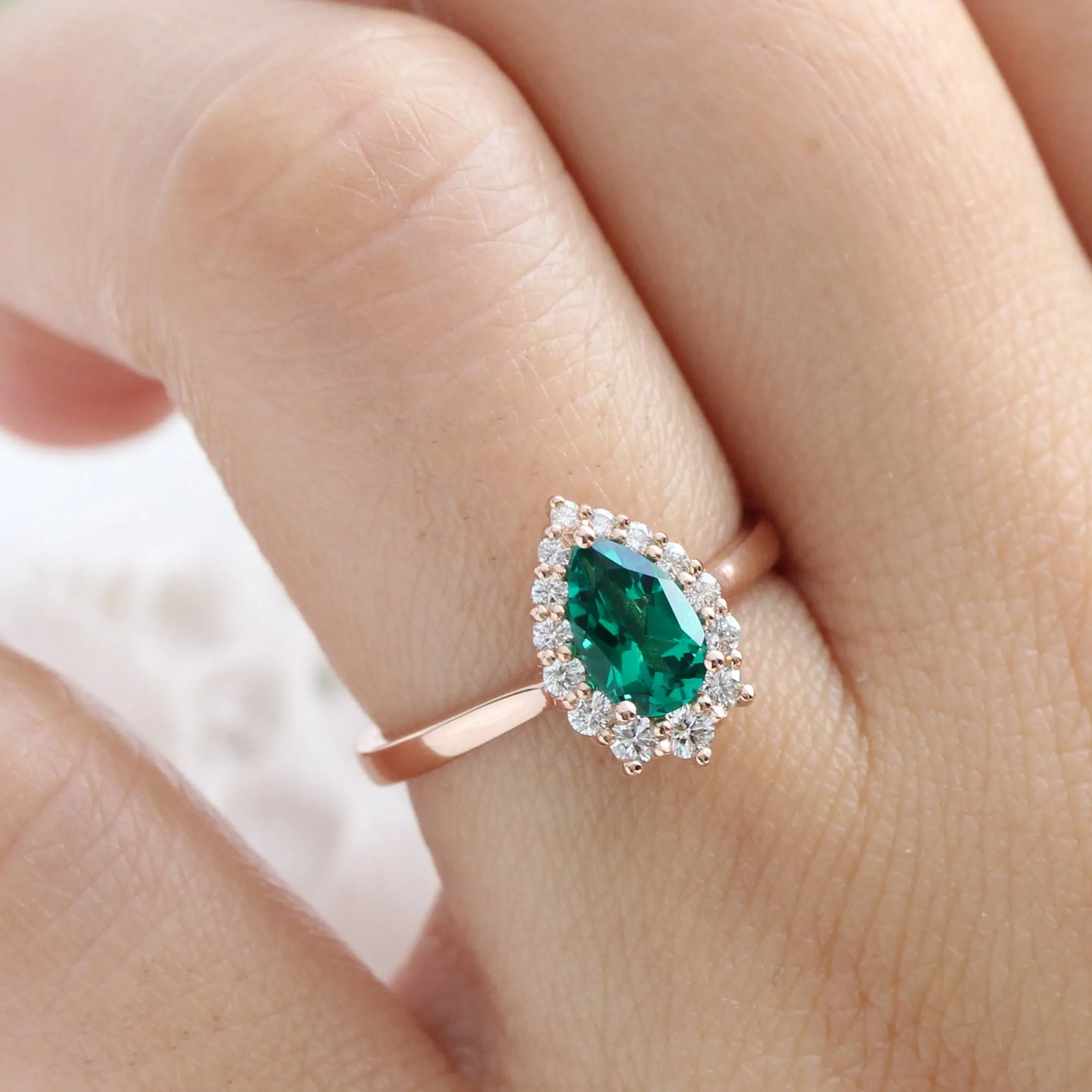 Pear Emerald Engagement Ring in Tiara Halo Diamond Tapered Band