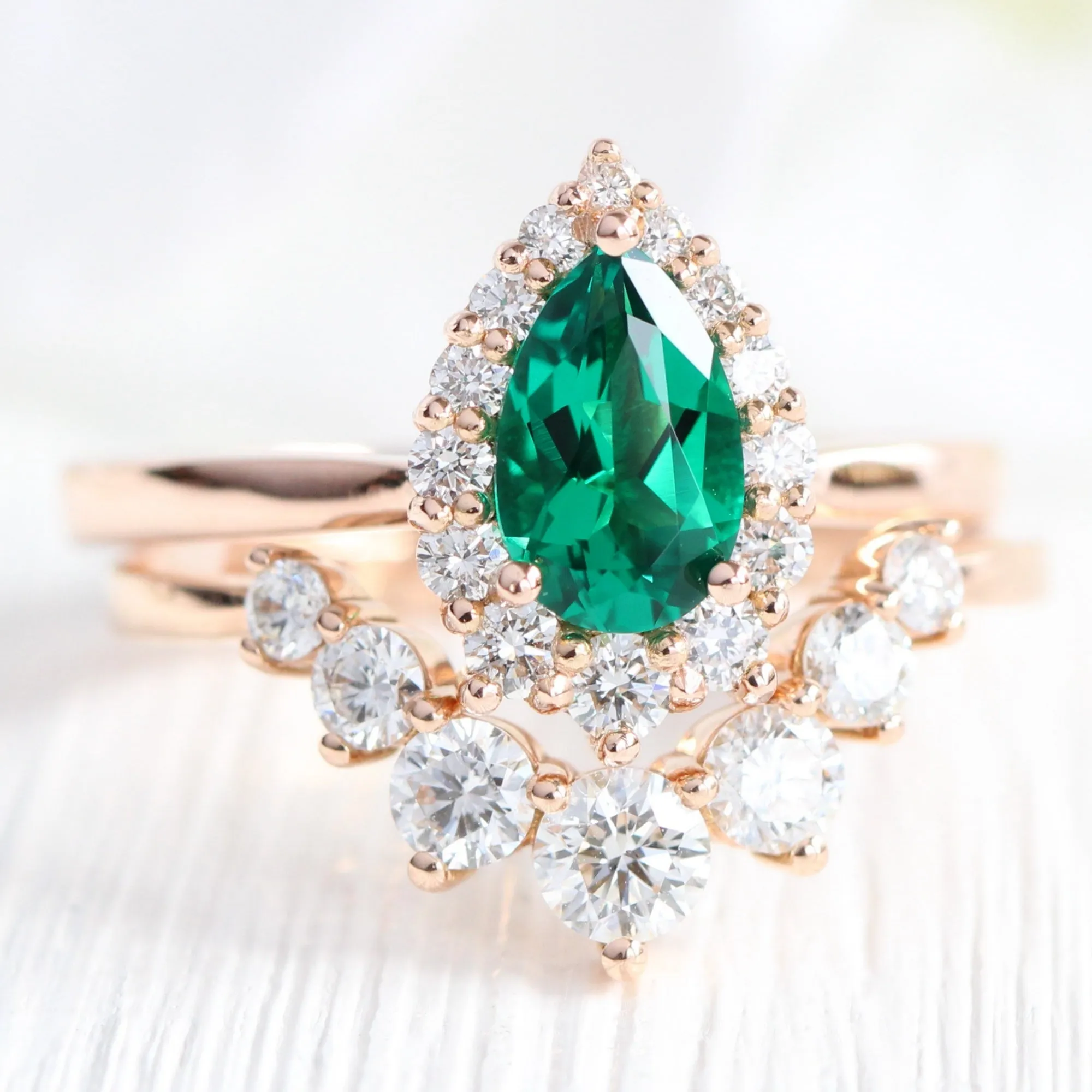 Pear Emerald Engagement Ring in Tiara Halo Diamond Tapered Band