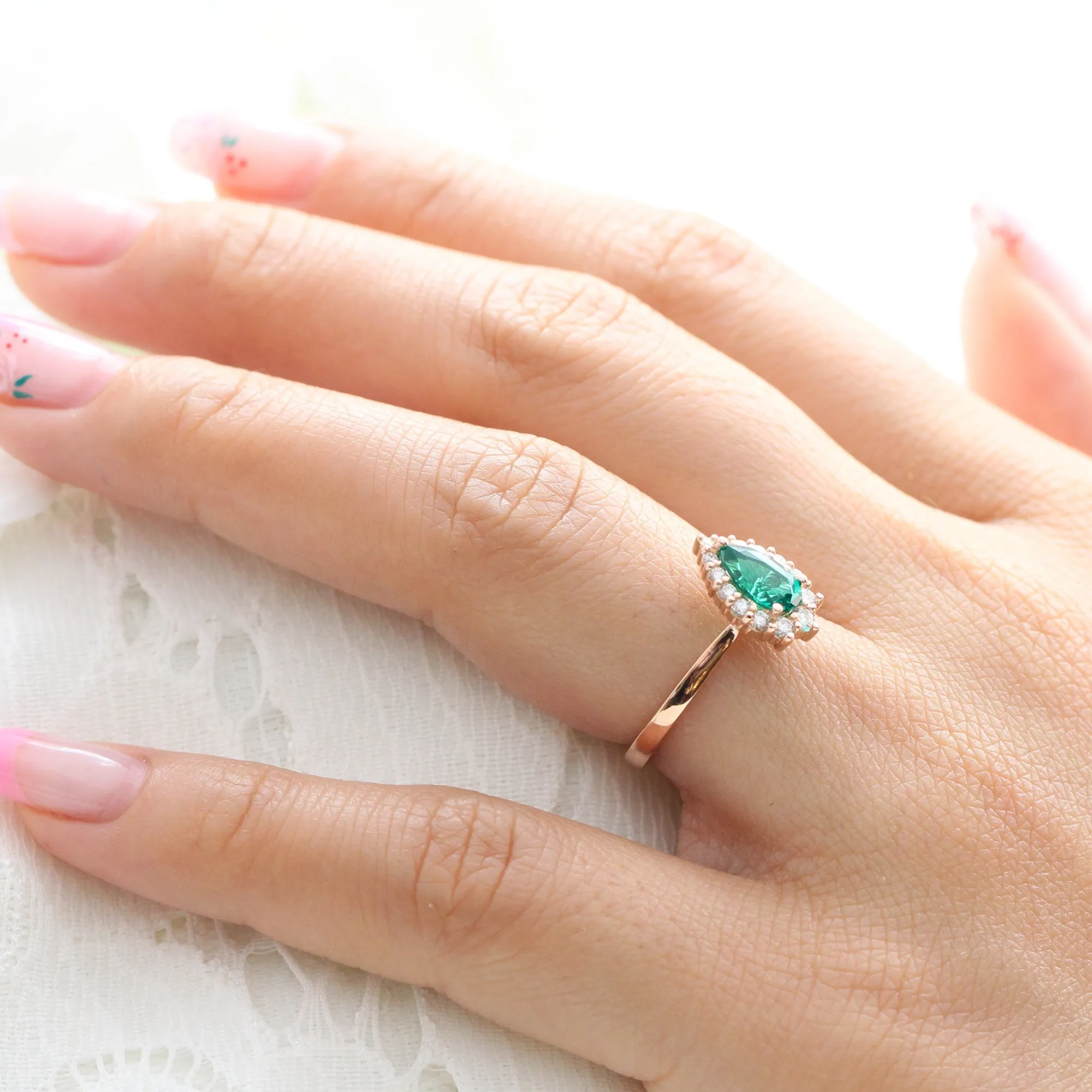 Pear Emerald Engagement Ring in Tiara Halo Diamond Tapered Band