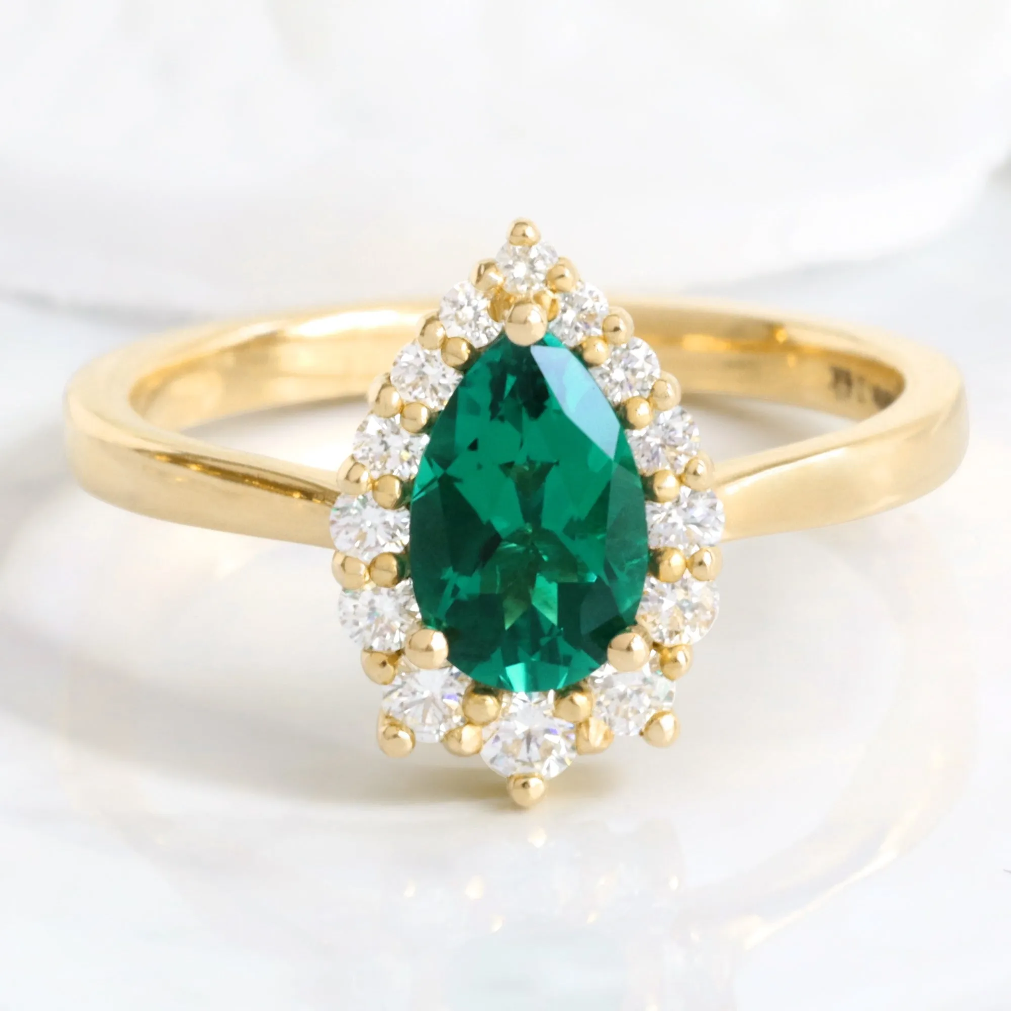 Pear Emerald Engagement Ring in Tiara Halo Diamond Tapered Band